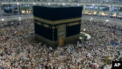 FILE - Muslim pilgrims circle the Kaaba, the black cube at center, inside the Grand Mosque during the annual pilgrimage, known as the hajj, in the Muslim holy city of Mecca, Saudi Arabia. 