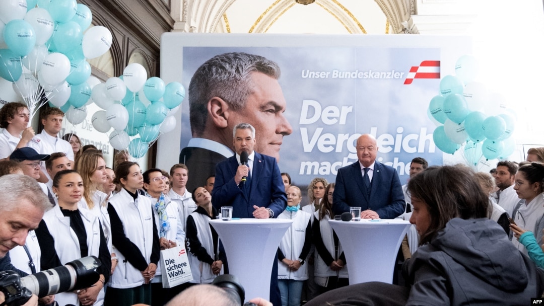 FILE - Austrian Chancellor and Head of the Austrian People's Party (OeVP) Karl Nehammer (L) stands next to OeVP general secretary Christian Stocker during their election rally in Vienna, Sept. 27, 2024.