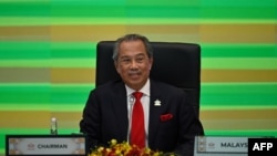 Malaysia's Prime Minister Muhyiddin Yassin takes part in the online Asia-Pacific Economic Cooperation leaders' summit in Kuala Lumpur on Nov. 20, 2020.