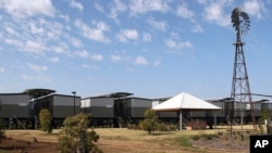 In this Sept. 11, 2012, file photo, temporary accommodations are being built to house workers for a local coal mining boom in Narrabri, Australia, near Gunnedah, 450 kilometers (280 miles) northwest of Sydney.