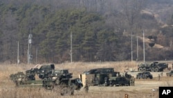 FILE - U.S. Army armored vehicles are seen during a military exercise in Yeoncheon, South Korea, near the border with North Korea, South Korea, Feb. 27, 2019. 
