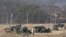 FILE - U.S. Army armored vehicles are seen during a military exercise in Yeoncheon, South Korea, near the border with North Korea, South Korea, Feb. 27, 2019. 