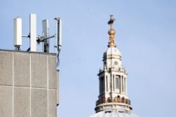 Mobile network phone masts are visible in front of St Paul's Cathedral in the City of London, Jan. 28, 2020.