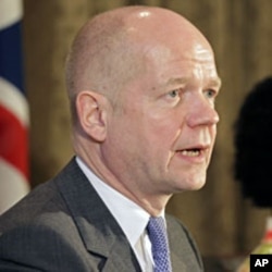 British Foreign Secretary William Hague speaks at a news conference in Cape Town, February 13, 2012