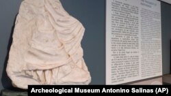 A fragment, belonging to a draped figure on the east side of the Parthenon frieze, the temple built between 449 and 438 BC on the Acropolis of Athens, is seen in the Museum in Palermo, Italy, Jan. 5, 2022.