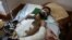 Ghassan Al-masri, 22, rests at the Shifa hospital in Gaza City, May 13, 2021, where he is being treated for injuries caused by a May 10 Israeli strike that hit a near his home in the town of Beit Hanoun.