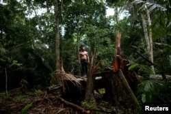 An indigenous man called Tebu, of Uru-eu-wau-wau tribe, looks on in an area deforested by invaders in the village of Alto Jaru, at the Uru-eu-wau-wau Indigenous Reservation near Campo Novo de Rondonia, Brazil February 1, 2019.