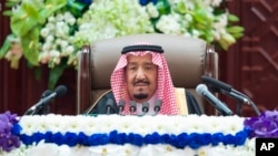 FILE - In this photo provided by the Saudi Press Agency, Saudi King Salman gives his annual policy speech in the hall of the Shura Council, Nov. 19, 2018.