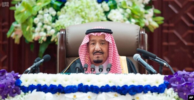 In this photo provided by the Saudi Press Agency, Saudi King Salman gives his annual policy speech in the hall of the Shura Council, Nov. 19, 2018.
