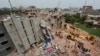 FILE - A view of rescue workers attempting to find survivors from the rubble of the collapsed Rana Plaza building in Savar, Bangladesh, April 30, 2013.