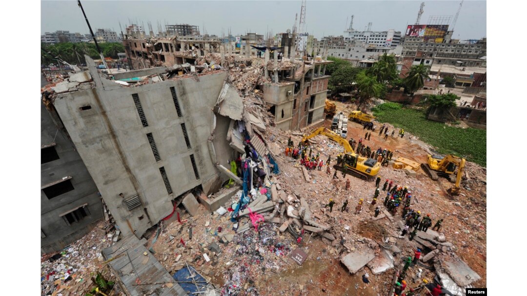 FILE - A view of rescue workers attempting to find survivors from the rubble of the collapsed Rana Plaza building in Savar, April 30, 2013.