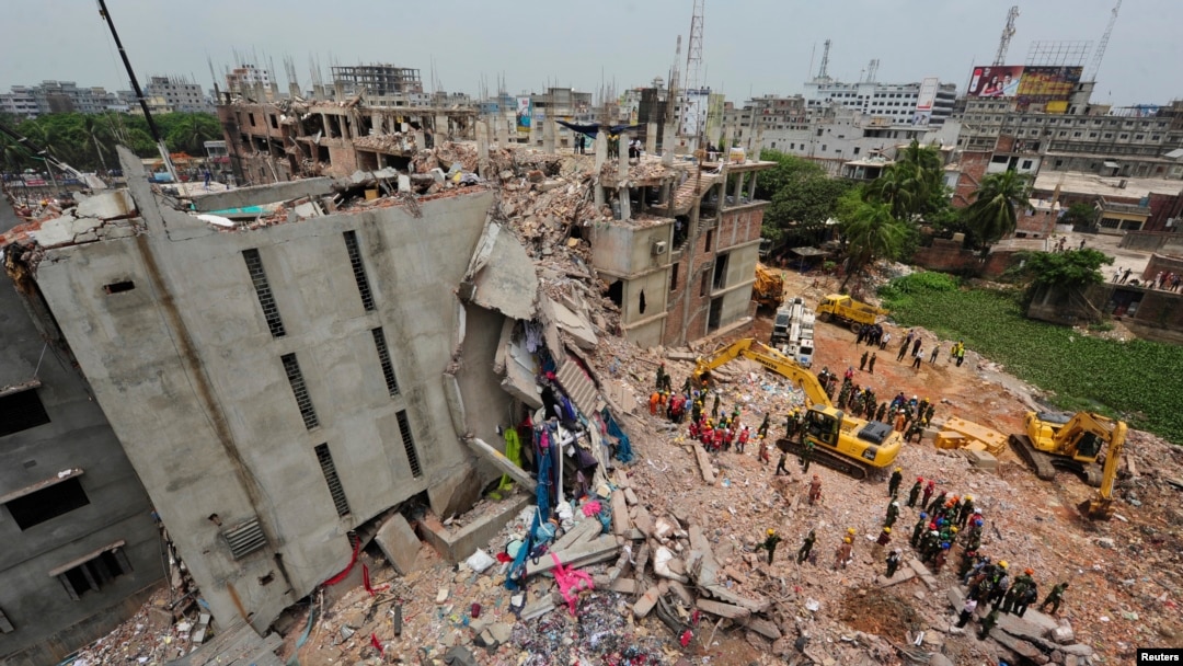 FILE - A view of rescue workers attempting to find survivors from the rubble of the collapsed Rana Plaza building in Savar, Bangladesh, April 30, 2013.