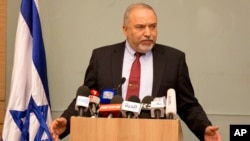 Israeli Defense Minister Avigdor Lieberman delivers a statement at the Knesset, Israel's Parliament, in Jerusalem, Wednesday, Nov. 14, 2018.