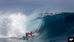 Kauli Vaast, of France, rides a wave during the men's gold medal final of the surfing competition at the 2024 Summer Olympics, Aug. 5, 2024, in Teahupo'o, Tahiti.