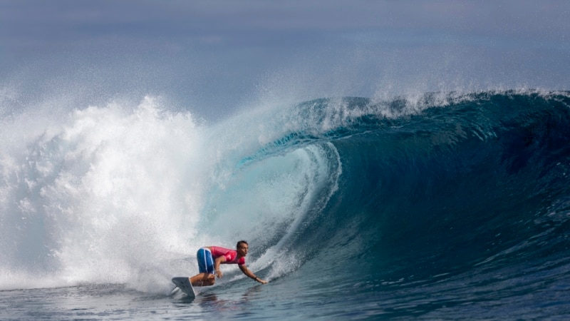 French Polynesian Kauli Vaast and Caroline Marks of US win gold at Olympics surfing