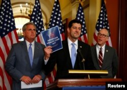 FILE - U.S. House Majority Leader Kevin McCarthy, left, U.S. House Speaker Paul Ryan, center, and U.S. Representative Greg Walden hold a news conference on the American Health Care Act on Capitol Hill in Washington, March 7, 2017.