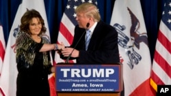 Former Alaska Gov. Sarah Palin endorses Republican presidential candidate Donald Trump during a rally at the Iowa State University in Ames, Jan. 19, 2016.