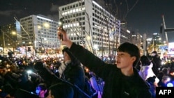 People take part in a protest calling for the ouster of South Korean President Yoon Suk Yeol outside the National Assembly in Seoul on Dec. 7, 2024.