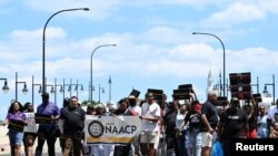 FILE: Demonstrators protest against the Akron police shooting death of Black man Jayland Walker in Akron, Ohio, U.S. 7.3.2022