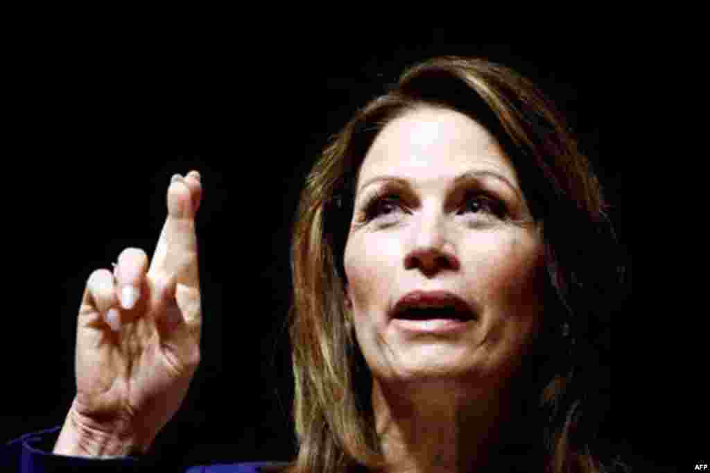 Republican presidential candidate, Rep. Michele Bachmann, R-Minn. gestures while speaking during a campaign stop at Principal Financial Group in Des Moines, Iowa, Thursday, Dec. 29, 2011. (AP Photo/Chris Carlson)