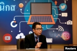 Sawang Boonmee, deputy secretary-general of Election Commission talks as he works in a social media war room in Bangkok, Thailand, March 8, 2019.