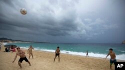 Mexico Tropical Weather Newton: People play on El Medano Beach before the arrival of Hurricane Newton in Cabo San Lucas, Mexico, Monday Sept. 5, 2016. Authorities at the southern end of Mexico's Baja California peninsula ordered schools closed and set up emergency shelters as Hurricane Newton gained strength while bearing down on the twin resorts of Los Cabos for a predicted arrival Tuesday morning. 