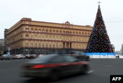 Cars drive past the headquarters of the FSB security service, the successor to the KGB in central Moscow on December 30, 2016.