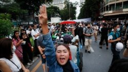 Pro-democracy demonstrators flash a three-finger salute of defiance during a protest rally in the Silom business district of Bangkok, Thailand, Thursday, Oct. 29, 2020. The protesters continue to gather Thursday with their three main demands of…