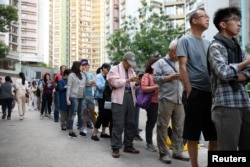 People line up to vote in district council elections in South Horizons in Hong Kong, China November 23, 2019. REUTERS/Laurel Chor