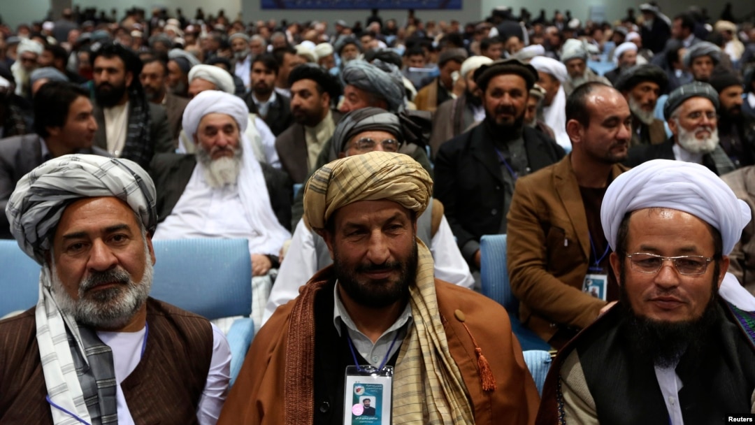Members of the Loya Jirga, grand council, attend during the last day of the Loya Jirga, in Kabul, Nov. 24, 2013.