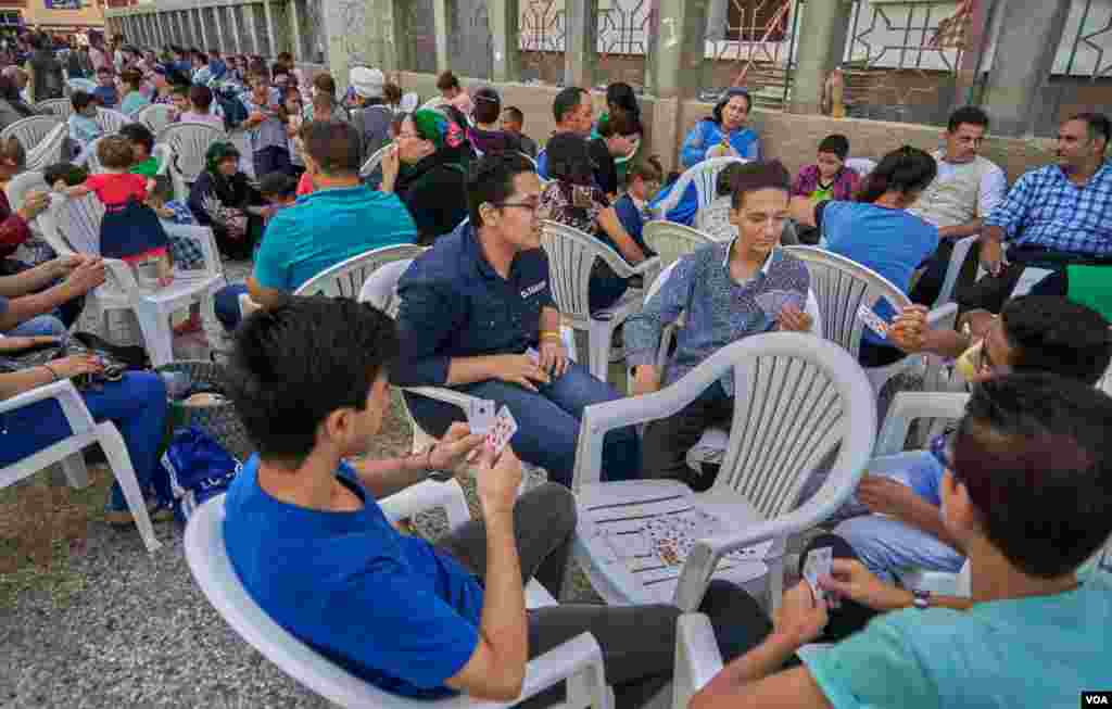 Families and friends gather in the monastery during midday to avoid the bright sun, enjoy lunch and socialize. Sunday, August 18, 2019.