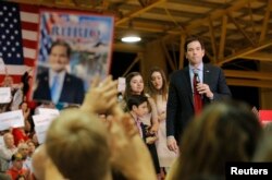 FILE - Republican U.S. presidential candidate Senator Marco Rubio pauses as his children look on during a Super Tuesday campaign rally in Miami, Fla., March 1, 2016.