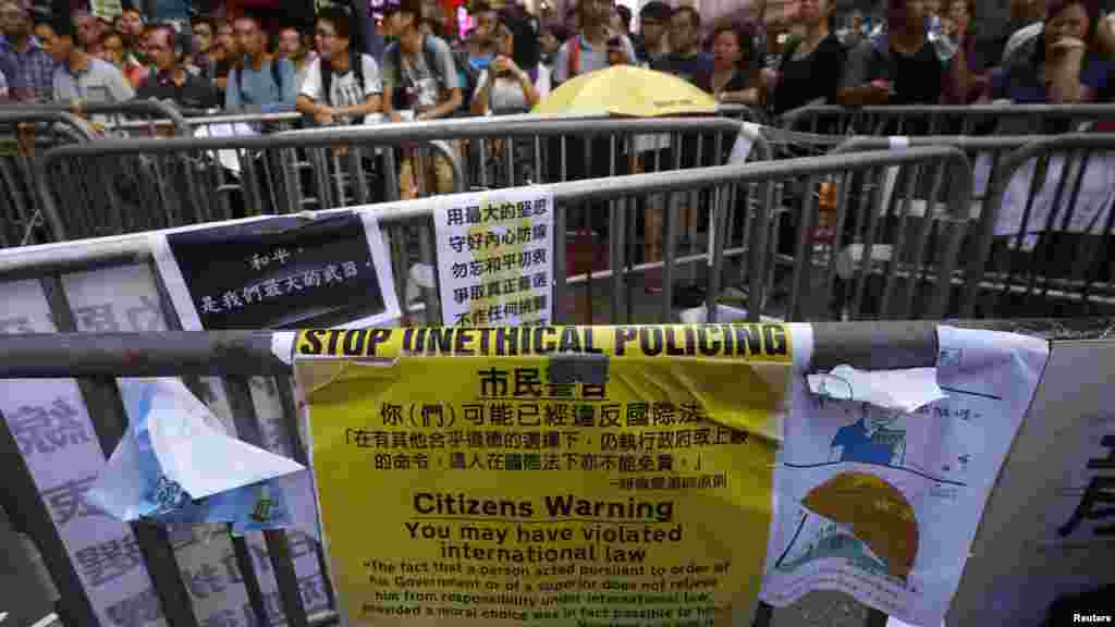 A message left by anti-Occupy protesters is displayed on Nathan Road recaptured by pro-democracy protesters at Mongkok shopping district in Hong Kong, Oct. 20, 2014. 
