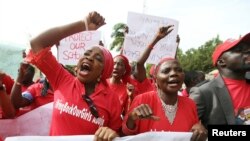 Nigerians take part in a protest demanding for the release of secondary school girls abducted from the remote village of Chibok, in Asokoro district in Abuja, Nigeria, May 13, 2014. 