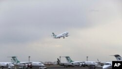 FILE - A Mahan Air passenger plane takes off from Mehrabad Airport in Tehran, Iran, Feb. 7, 2016.