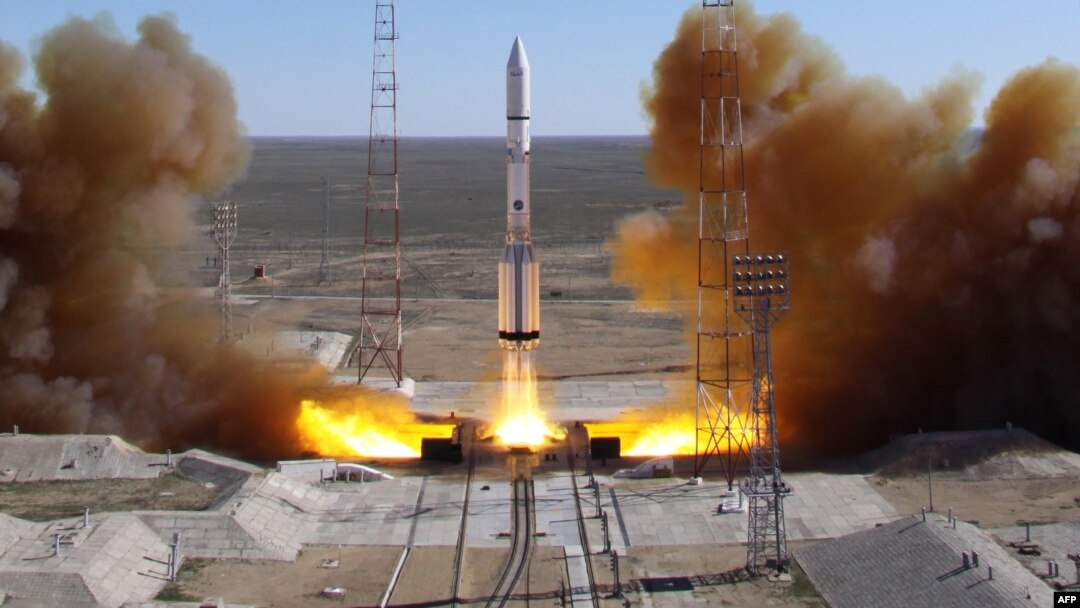 FILE - A Russian-built Proton rocket with Russian relay satellite Luch-5V and the Kazakh communication satellite KazSat-3 aboard blasts of from a launch pad in the Russian-leased Kazakhstan's Baikonur cosmodrome, April 28, 2014.