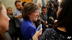 Sen. Susan Collins, R-Maine, speaks to members of the media outside her office on Capitol Hill in Washington, Sept. 17, 2018. 