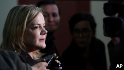 Workers' Party President Gleisi Hoffmann speaks to the press before the start of a Workers' Party National Executive members meeting to discuss the replacement of jailed presidential candidate, former President Luiz Inacio Lula da Silva, in Curitiba, Brazil, Sept. 11, 2018.