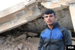 Suliman, 17, says he saw bodies of children and women on the front lines in Baghuz, Syria, where IS is fighting for its last sliver of land. IS may be almost finished officially, he says, but attacks continue daily. March 2, 2019, in Tel Hamees, Syria. (H. Murdock/VOA)
