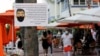 Znak za obavezno nošenje maski u Majami Biču (Foto:AP/Lynne Sladky)