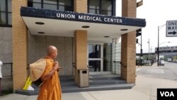 Buddhist monk Sutham Nateetong walks in front of Union Medical Center, in Chicago. June 3, 2019