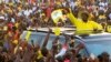 Uganda's President and the presidential candidate Yoweri Museveni of the ruling party National Resistance Movement (NRM) waves to his supporters as he arrives at a campaign rally ahead of the February 18 presidential elections in Entebbe, Uganda Feb. 10, 2016.