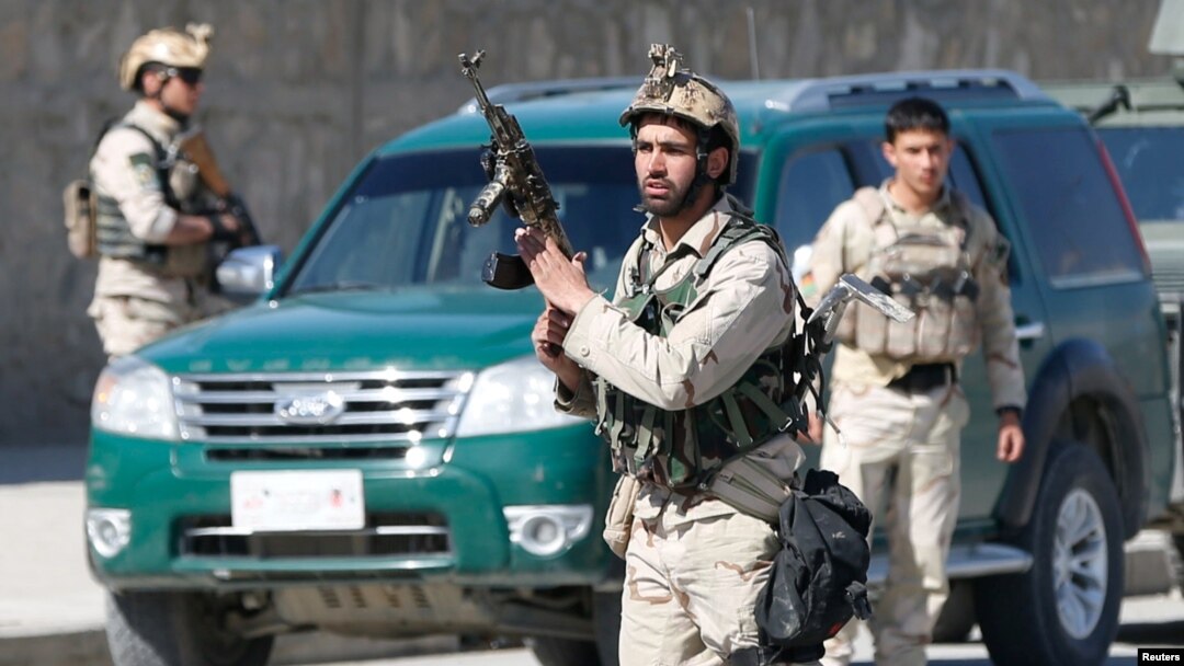 FILE - Afghan security forces arrive at the site of a showdown between Taliban and Afghan forces in Kabul, Afghanistan, March 1, 2017. 