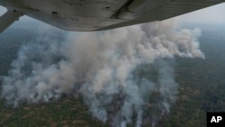 Fire consumes an area near Porto Velho, Brazil, Aug. 23, 2019. Brazilian state experts have reported a record of nearly 77,000 wildfires across the country so far this year, up 85% over the same period in 2018. 