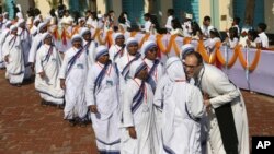 FILE - Bangladeshi Catholic nuns arrive to participate in a meeting with Pope Francis at the Church of the Holy Rosary in Dhaka, Bangladesh, Saturday, Dec. 2, 2017. (AP Photo/Aijaz Rahi)