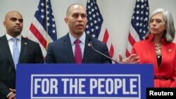 Democratic House caucus chairman Representative Hakeem Jeffries (D-NY), flanked by Rep. Colin Allred (D-TX) and Rep. Katherine Clark (D-MA), leads a news conference after a House Democratic party caucus meeting at the U.S. Capitol, Washington, U.S., Jan. 9, 2019.