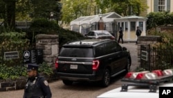 A vehicle drives onto the property of Gracie Mansion, the official residence of New York City Mayor Eric Adams, Sep. 26, 2024, in New York.