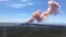 In this photo provided by the U.S. Geological Survey, red ash rises from the Puu Oo vent on Hawaii's Kilauea Volcano after a magnitude-5.0 earthquake struck the Big Island, Thursday, May 3, 2018 in Hawaii Volcanoes National Park.