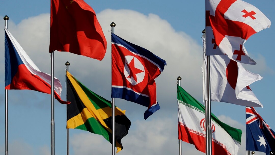 The North Korean flag, center, flies amongst flags from many nations as they fly at the Olympic Village at the 2018 Winter Olympics in Gangneung, South Korea, Thursday, Feb. 1, 2018.