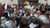 FILE - On Aug. 29, 2013, supporters celebrate the supreme court's decision to uphold the results of a presidential election outside the court in Accra, Ghana. The election of John Mahama was confirmed.